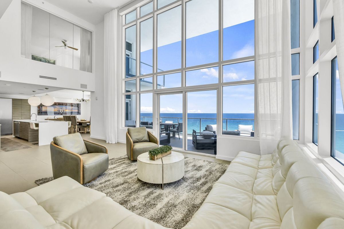 spacious beachfront living room with high ceilings